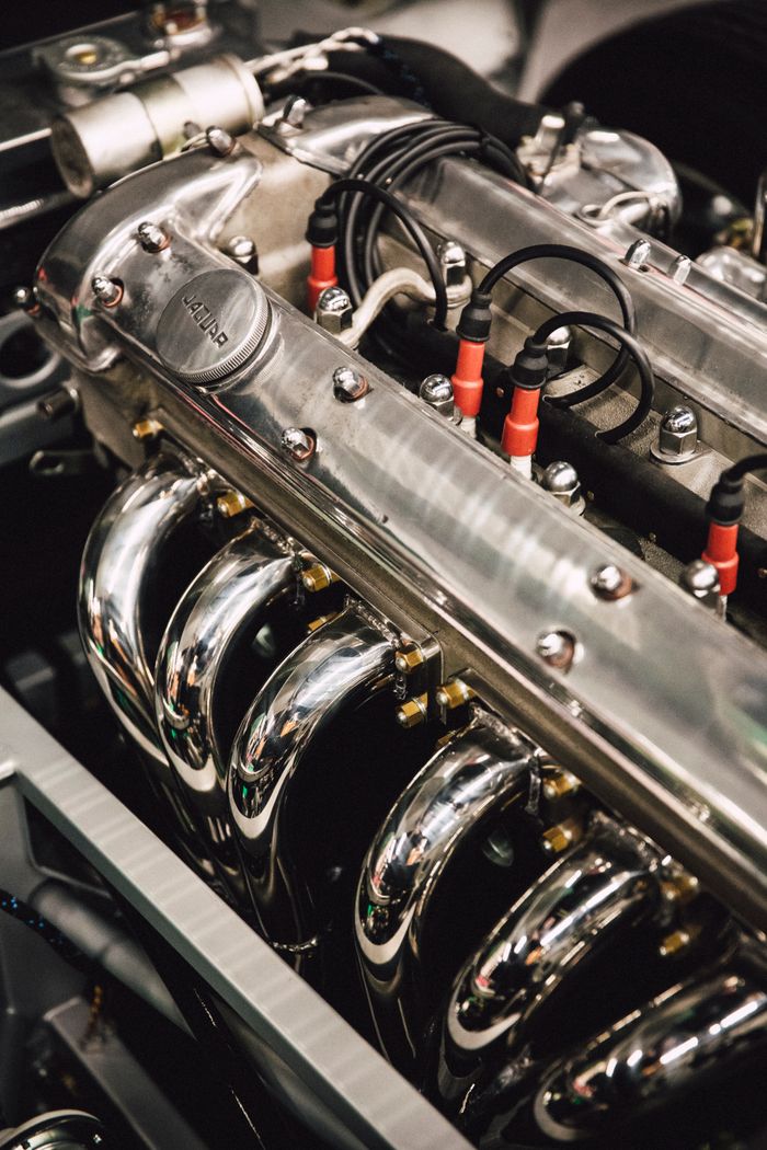 Detailed view of a polished chrome engine, showcasing luxury automotive design. splash auto zone