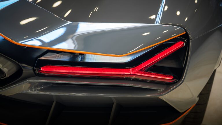 Detailed shot of a luxury car's rear tail light with sleek design and modern look. splash auto zone