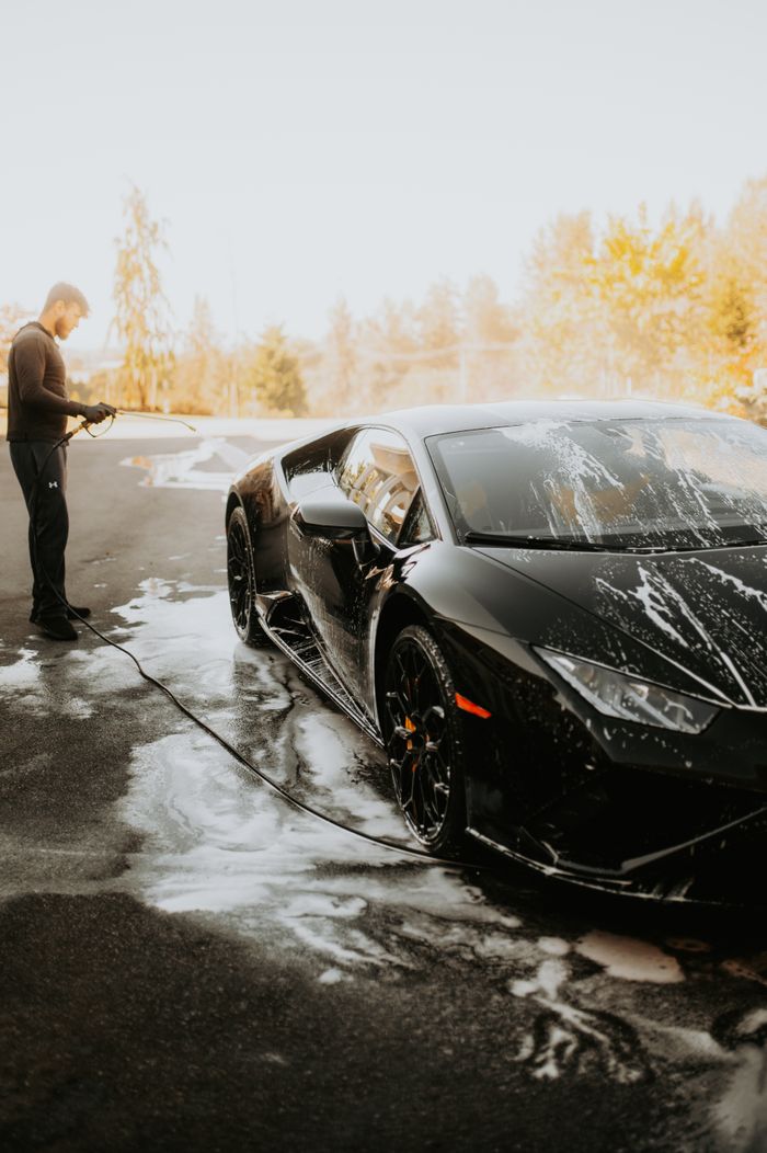 splash auto zone lamborgini black car car washing and detailing. car wash abu dhabi